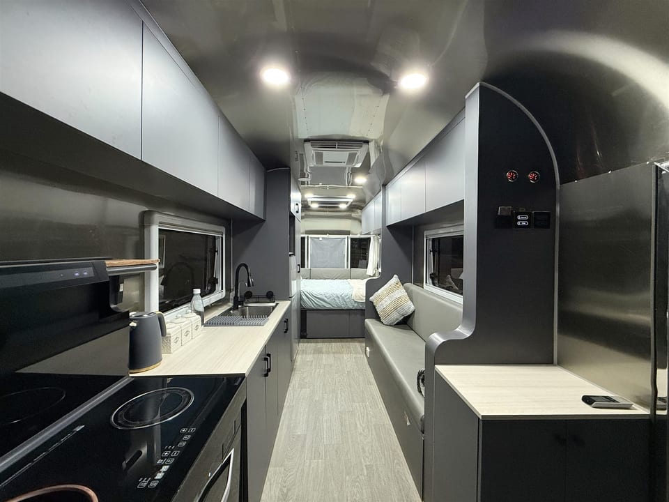 Kitchen, storage and living space inside the caravan