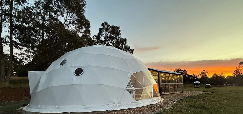 Dome exterior and outdoor pavilion in the last light of the day