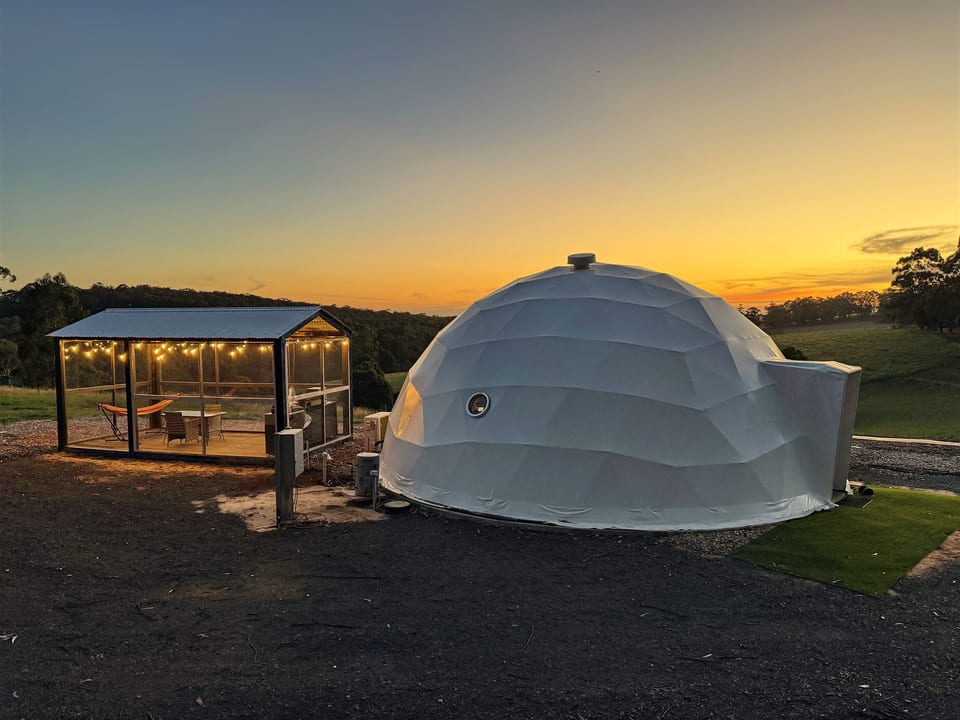The dome beside its pavilion overlooking the sunset