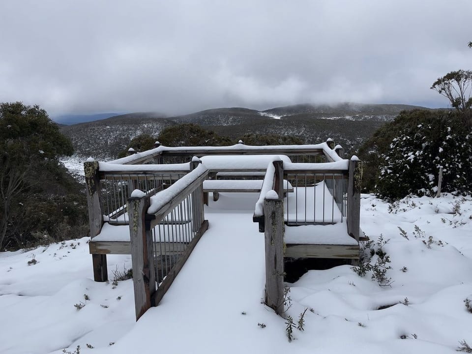 Snow-covered lookout and mountain landscape at Mt Baw Baw